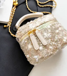Detailed macro view of dual metal zippers and smooth tweed texture on mini bag