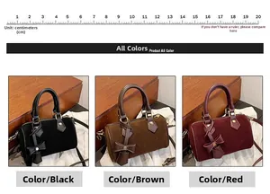 Three suede Boston bags in black, coffee, and burgundy with bows and shoulder straps