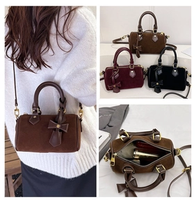 Three colors of suede pillow bags showing interior space and adjustable shoulder straps