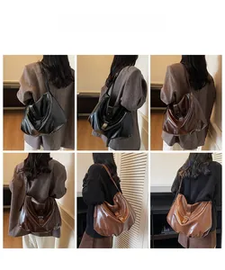 Three colors of oversized soft hobo bags shown with adjustable shoulder straps and buckles