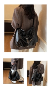 Detail view of glossy black PU leather shoulder bag with adjustable strap and metal buckle