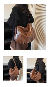 Detailed view of deep brown hobo bag with oily leather texture and wide shoulder strap