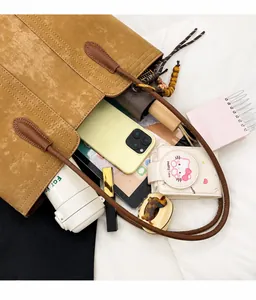 Macro view of the large capacity tote bag showing spacious interior with daily essentials