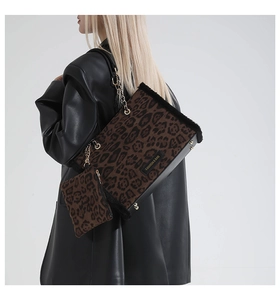 Model wearing leopard print faux fur tote bag with gold chain strap and mini pouch