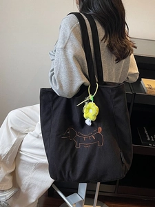 Bolso tote de pana a la moda con bordado de perro salchicha y colgante de flor amarilla