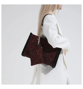 Close-up of leopard print tote bag with soft faux fur texture and gold chain strap