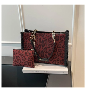 Detailed macro view of the burgundy leopard print tote bag with soft faux fur accents