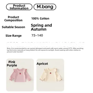 Detail view of cotton long sleeve girls' shirt with cherry embroidery and wood ear trim