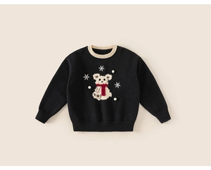 Close-up of girls black knitted sweater featuring white teddy bear and snowflake patterns