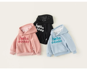 Flat lay of colorful children's hoodies with artistic hello print and front pocket detail