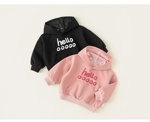 Detail view of cotton hoodies featuring kangaroo pockets and ribbed cuffs in black and pink