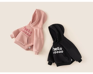 Close-up of pink and black kids hoodies featuring flocked hello letter print on soft cotton