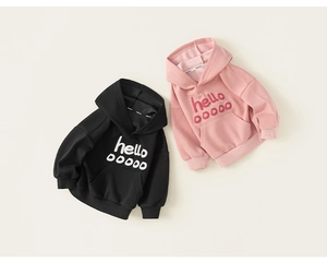 Detail of kids hooded sweatshirt featuring letter print and front kangaroo pocket