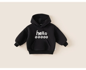Close-up of black cotton hoodie featuring white hello print and ribbed cuffs for kids