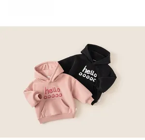 Close-up of pink and black kids fleece hoodies with hello embossed letter design