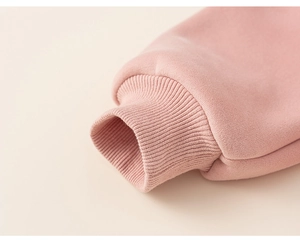 Detailed macro view of soft pink ribbed cuffs and inner fleece fabric for girl's hoodie