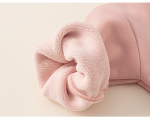 Detail of pink girls hoodie showing warm fleece lining and neat ribbed cuff stitching