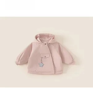 Detail view of pink baby winter hooded jacket with star charm and ribbed cuffs