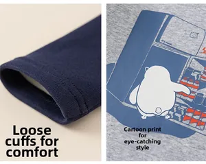 Dettagli dei polsini a coste blu e stampa pinguino su maglia termica grigia bimbi
