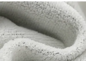 Detailed macro view of soft white fleece lining on children's winter sport trousers