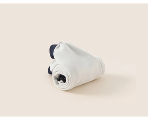 Detail of navy blue boys winter trousers showing thick beige fleece lining for warmth