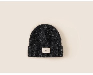 Detail of black mixed-knit beanie with a wide folded brim and a woven 'agg' label