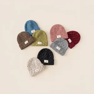 Kids colorful knit beanie hats in 8 trendy shades with stylish white woven labels