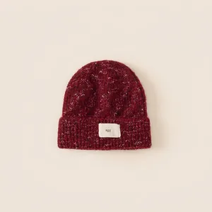 Burgundy chunky knit beanie with agg label and mixed color texture for children