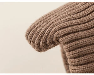Close-up of thick brown ribbed knit fabric showing soft texture and premium quality