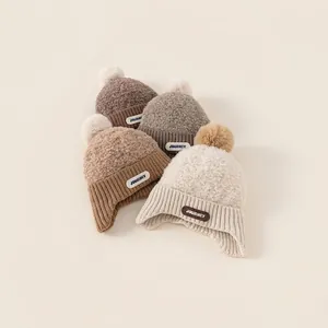 Kids knitted winter earflap hats with faux fur pom poms and warm fleece lining