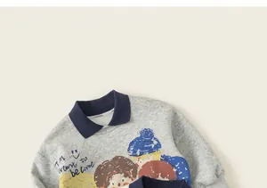 Close-up of kids grey sweatshirt with navy collar and colorful cartoon character print