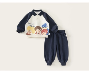 Detail of navy blue kids polo sweatshirt featuring cartoon prints and ribbed cuffs
