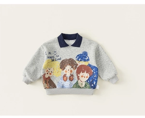 Close-up of children's grey polo sweatshirt with colorful cartoon print and navy collar