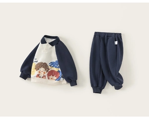 Detailed view of kids navy polo sweatshirt featuring cartoon prints and ribbed cuffs