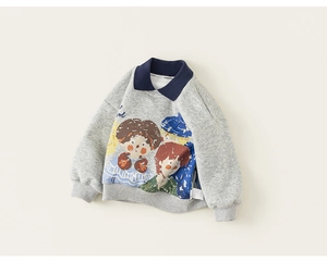 Detail of grey kids sweatshirt with navy polo collar and vibrant cartoon character print