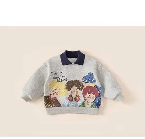 Detailed close-up of a grey children polo sweatshirt featuring a colorful cartoon print
