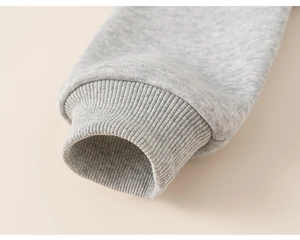 Close-up of elastic ribbed cuffs on a high-quality grey cotton sweatshirt for boys