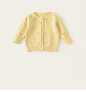 Close-up of baby girl knitted cardigan with ruffle collar and bow hollow embroidery