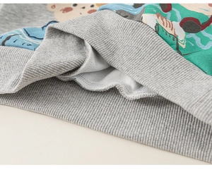 Detail of grey sweatshirt showing ribbed cuffs, soft fleece lining and cartoon print