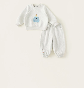 Detail of baby gray sweatshirt set with cartoon monster print and soft ribbed cuffs