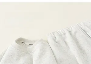 Close-up of soft grey cotton knit sweatshirt and elastic waist pants for kids