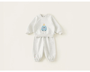 Detailed view of kids grey sweatshirt set featuring cartoon monster print and ribbed cuffs