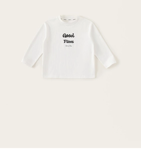 Detail of white cotton long sleeve t-shirt showing round neck and black letter print
