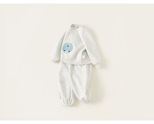 Detailed view of kids sweatshirt set featuring a blue cartoon monster and IN60BO lettering