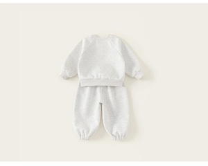 Detail view of light grey cotton knit sweatshirt and joggers set with ribbed cuffs