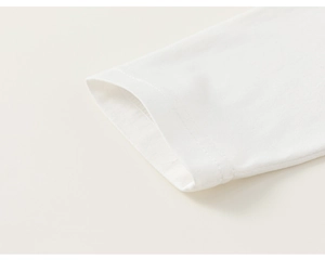 Detail of white cotton knit sleeve cuff with high-quality double-needle stitching