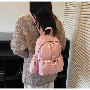 Pink quilted mini backpack for women showing back-wearing view with stylish soft padding