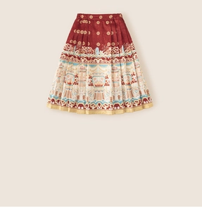 Detail of traditional floral prints and pleated fabric on girl's Chinese Mamian skirt