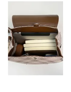 Spacious interior of plaid backpack featuring compartments for tablets and books