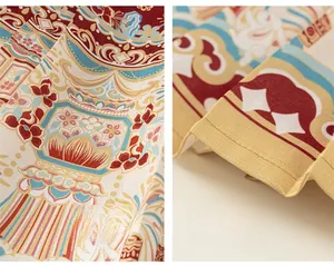 Detailed close-up of Chinese style floral patterns and pleated fabric for a girl's skirt
